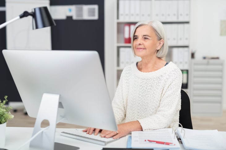 Senior working in an office