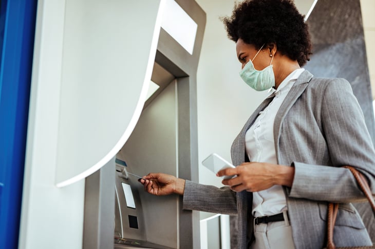 Woman withdrawing stimulus money
