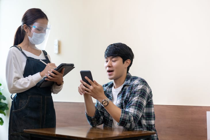 Man ordering from a digital restaurant menu