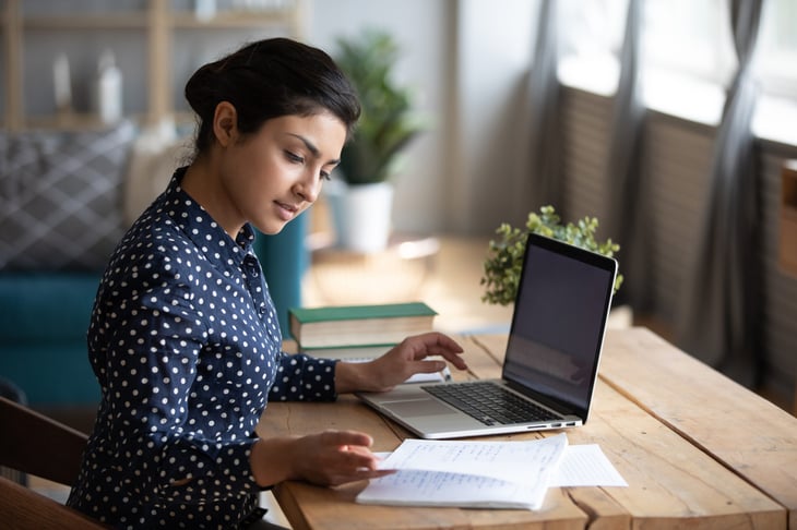 Young woman working remotely on her laptop