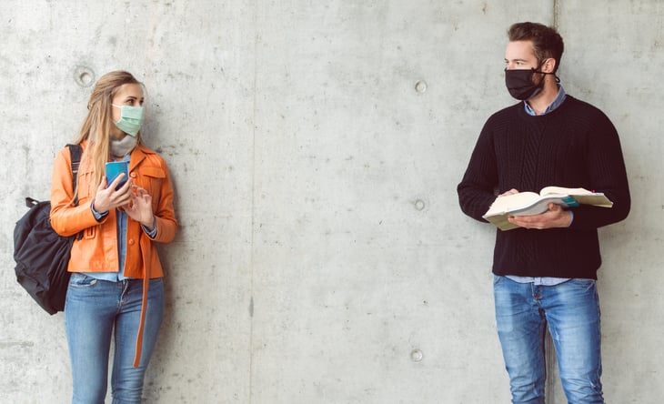 Two college students wearing face masks