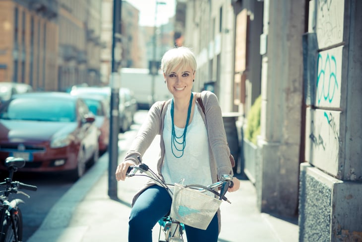 Young woman riding bike in the city