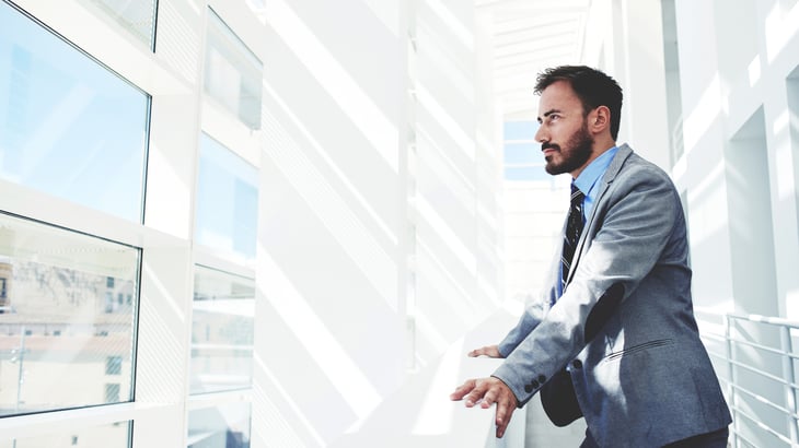 Young businessman making big plans