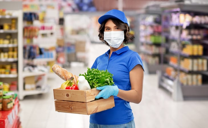 Grocery worker in a mask