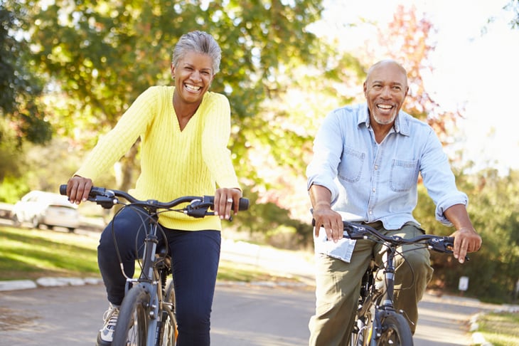 Senior couple riding bikes