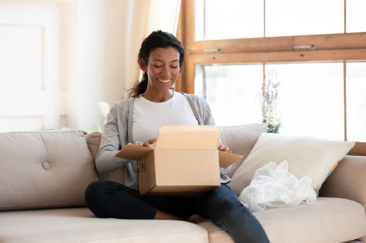 Woman opening a package 