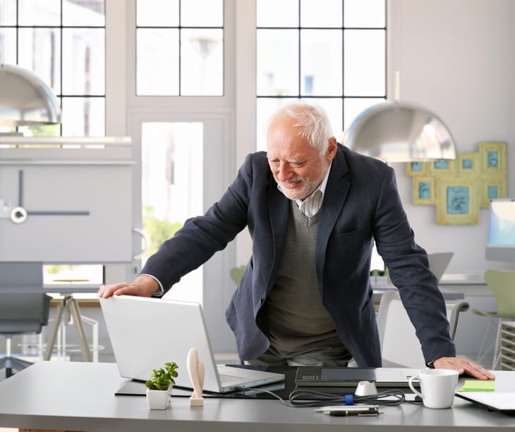 Senior worker checking his laptop
