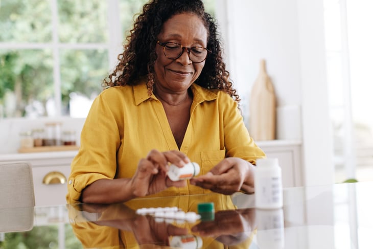 Senior woman taking medications