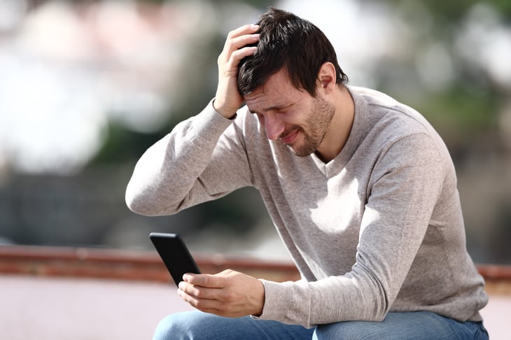 Man worrying about a volatile stock market