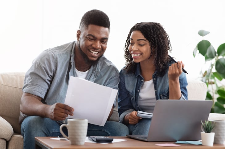 Young couple reviewing year-end tax documents
