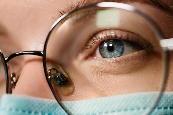 Woman wearing a mask and glasses