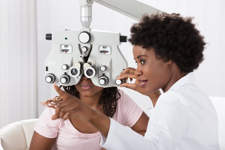 Optometrist and patient