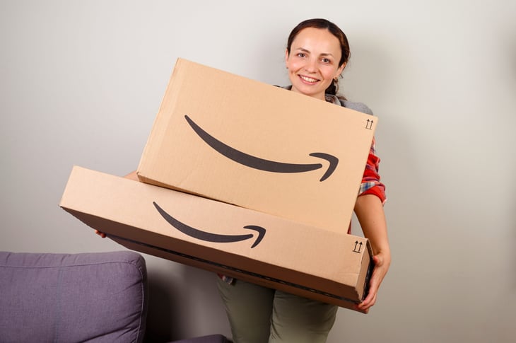 Woman holding Amazon packages