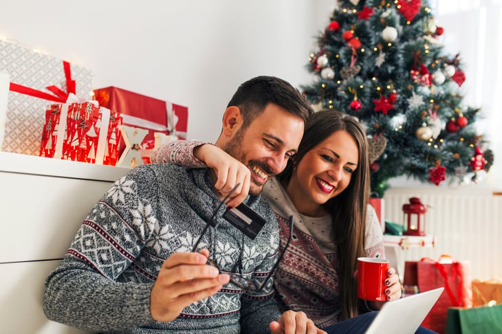 Couple shopping for holiday gifts online