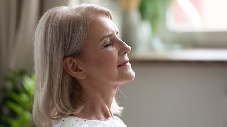 Older woman breathing deeply