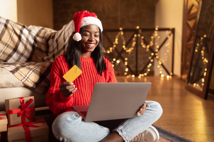 Woman shopping online for Christmas gifts