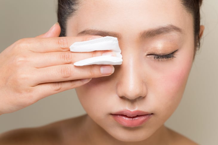 Woman removing makeup