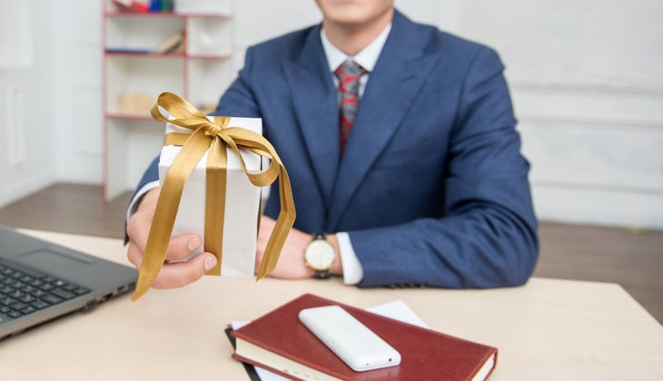 Boss giving a gift to an employee