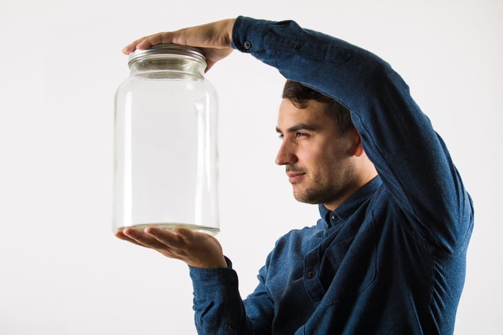 Man with canning jar
