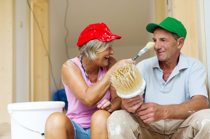 An older couple working on home improvement