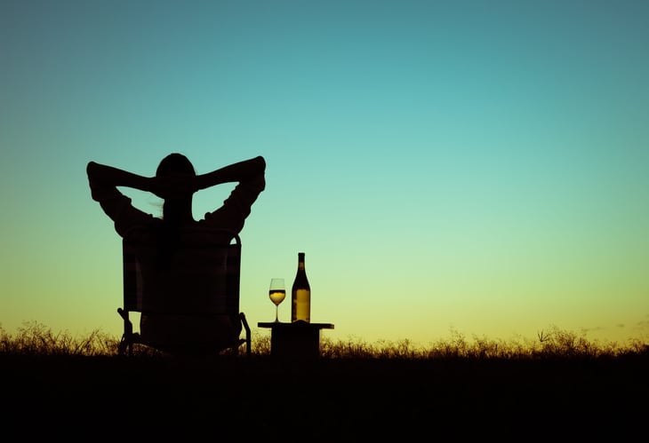 man relaxing wine retire early