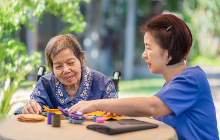 Senior with dementia doing occupational therapy