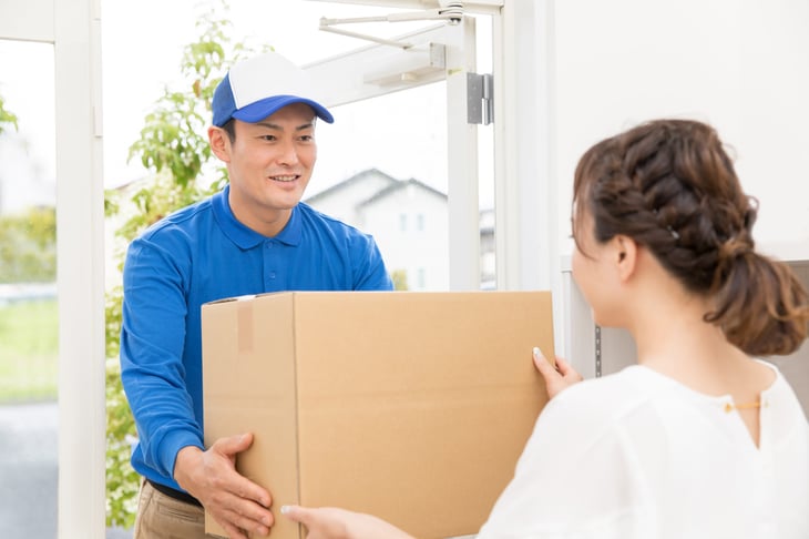 Delivery driver picking up package