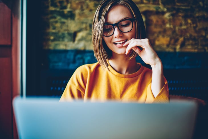 Young woman uses her laptop