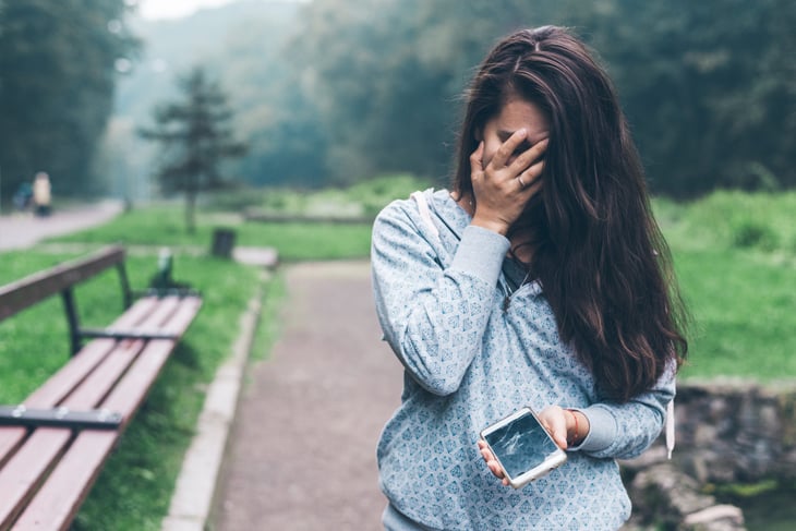 Woman upset about cracked cellphone