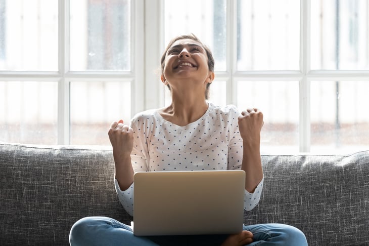 Excited taxpayer using a laptop
