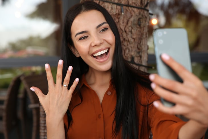 Woman showing off a diamond ring