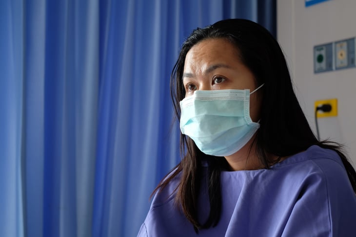 Woman wearing a mask at a hospital