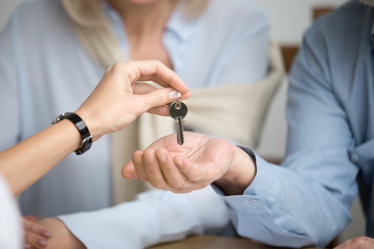 new homeowner receives house key