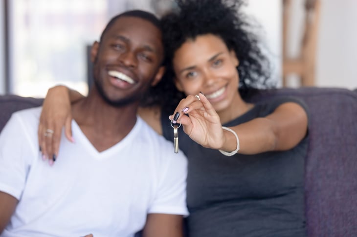 Couple with house key