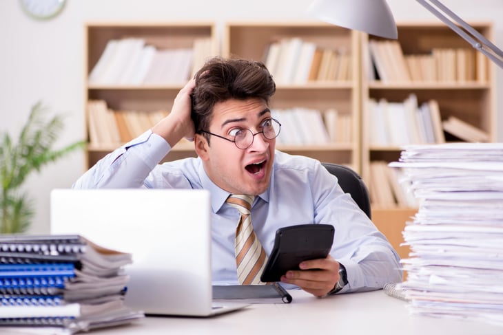 Stressed accountant doing taxes