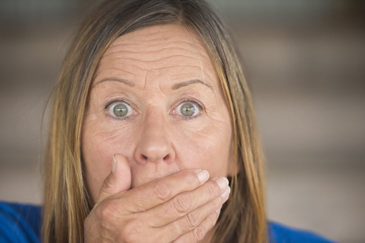 Surprised older woman in shock