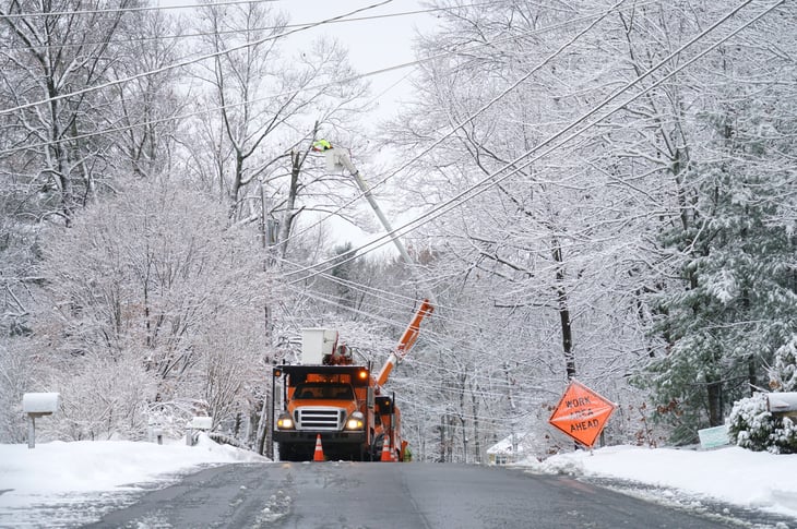 Workers repairing an electrical line during a power outage