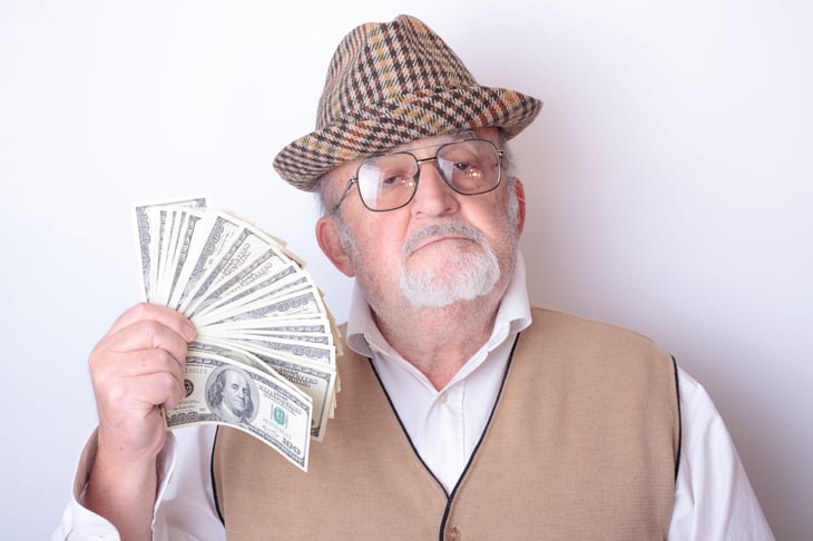Senior man with money