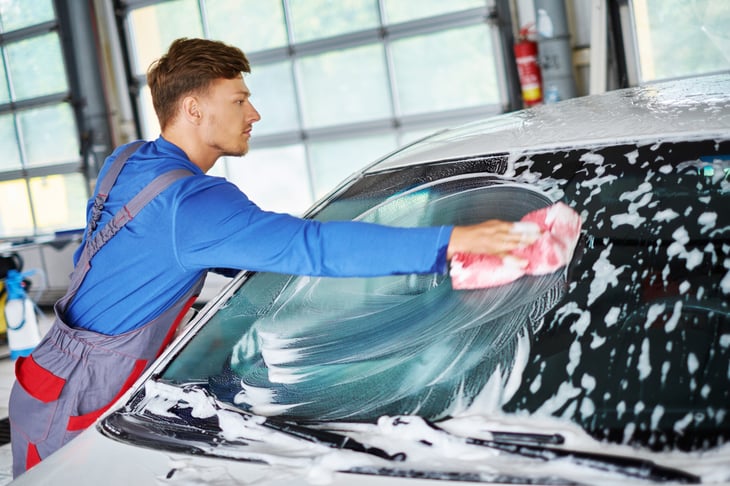 Man washing a car