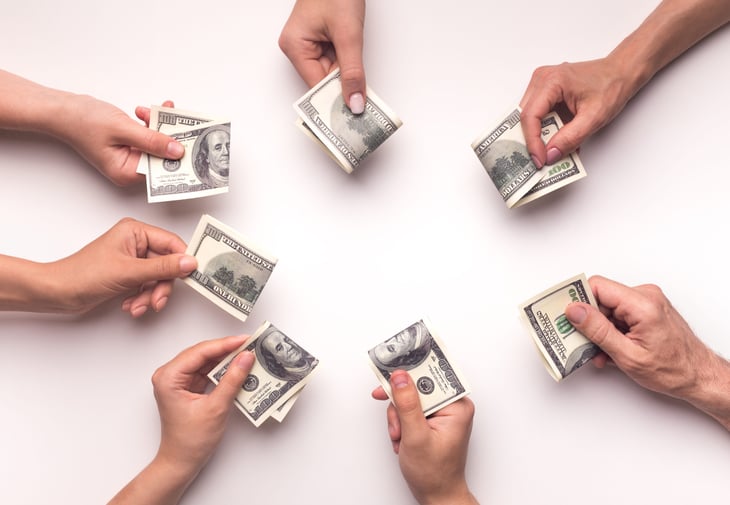 Crowdfunding hands with money