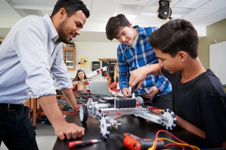 Teacher and students in a robotics class