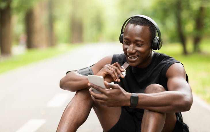 Man eating a protein bar