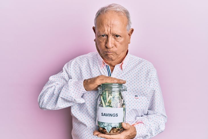 Pensioner with money box