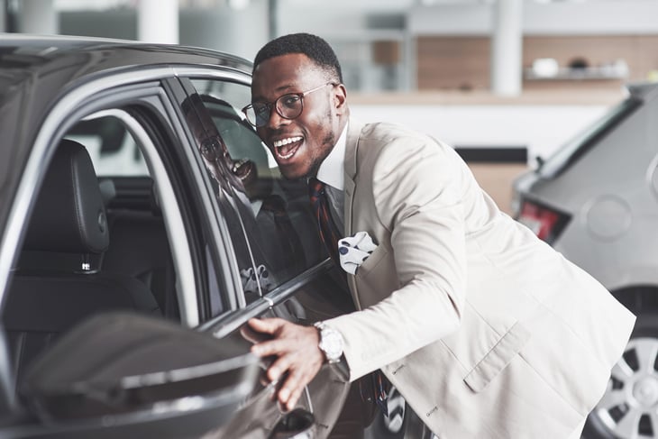 Happy man buying car