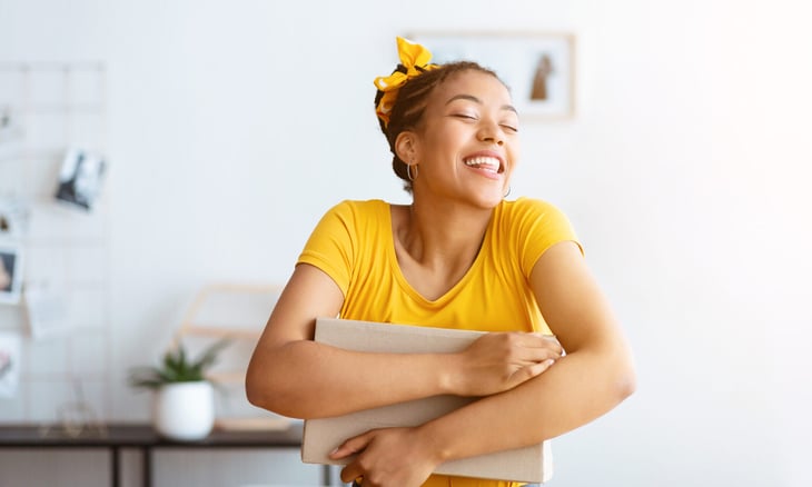 Woman hugging a package