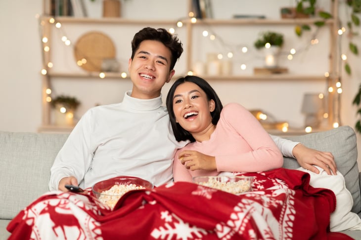 Couple watching TV at Christmas time