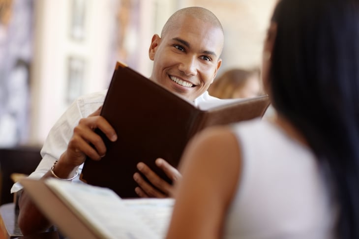Man holding restaurant menu