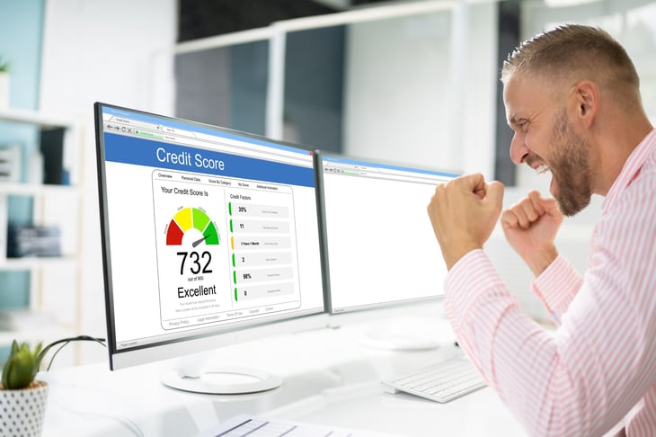Excited man checking credit score