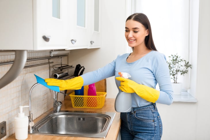 Woman cleaning her home