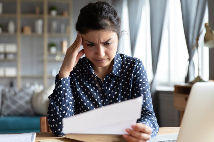 Woman looking at tax document